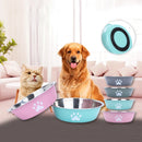 Comedouro em aço inoxidável para cães e gatos com base de silicone antiderrapante e estampa de patinhas, ideal para água e ração.